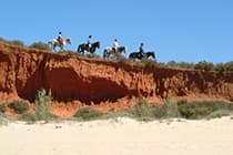 Horse riding by the beach